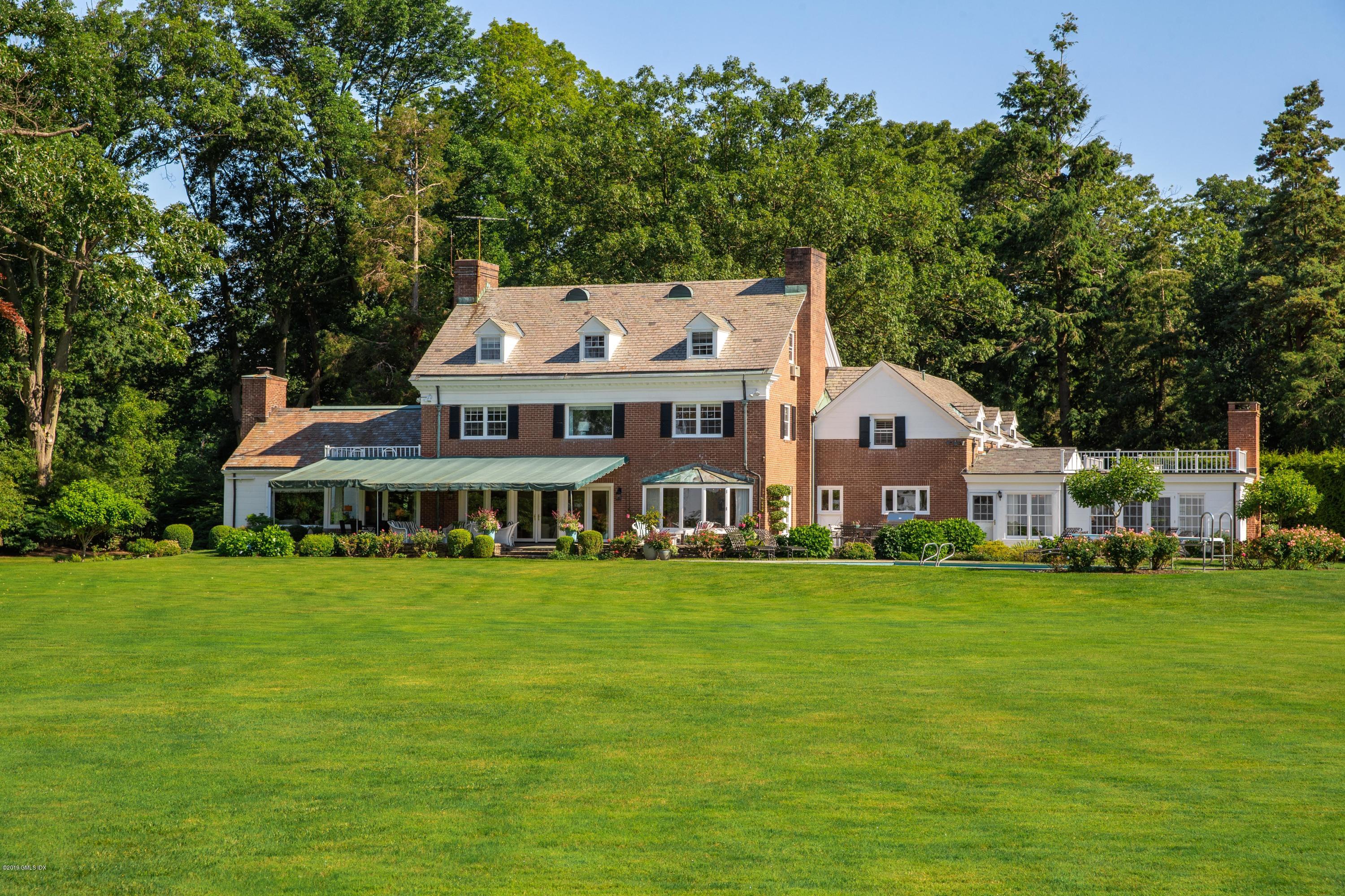 78-80 Cedar Cliff Road Riverside, CT 06878 - Photo 15 of 24 a front view of a house with a garden