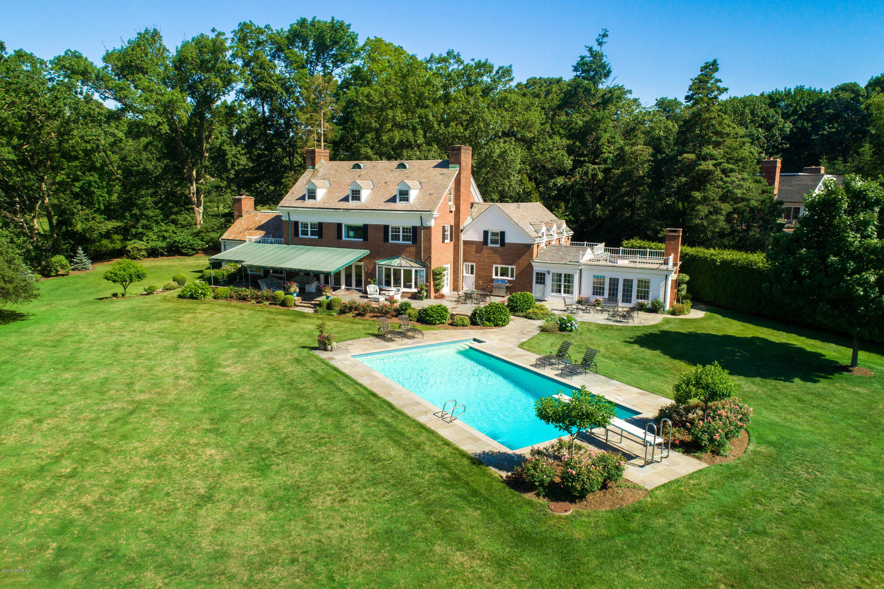 78-80 Cedar Cliff Road Riverside, CT 06878 - Photo 16 of 24 an aerial view of a house with swimming pool and garden