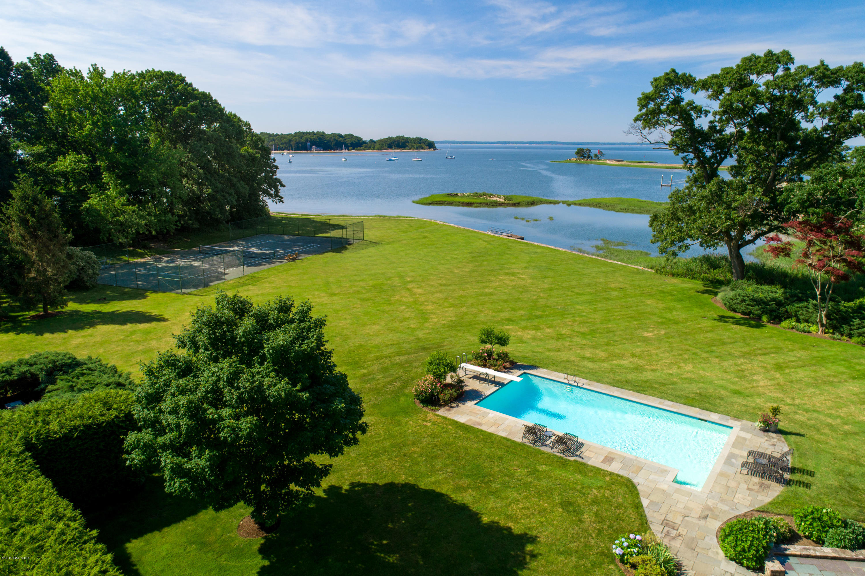 78-80 Cedar Cliff Road Riverside, CT 06878 - Photo 18 of 24 a view of an ocean and a yard