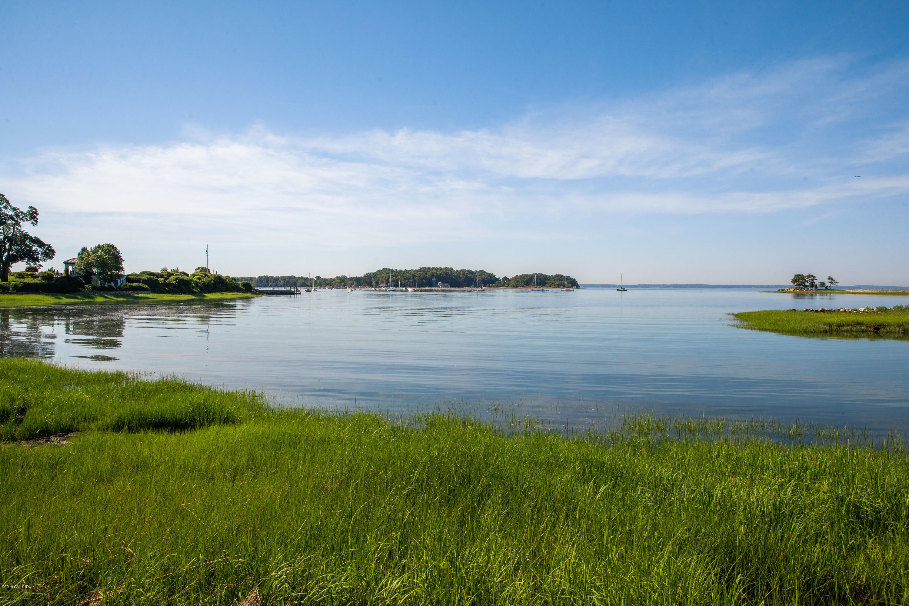 78-80 Cedar Cliff Road Riverside, CT 06878 - Photo 20 of 24 a view of a lake with houses in the back