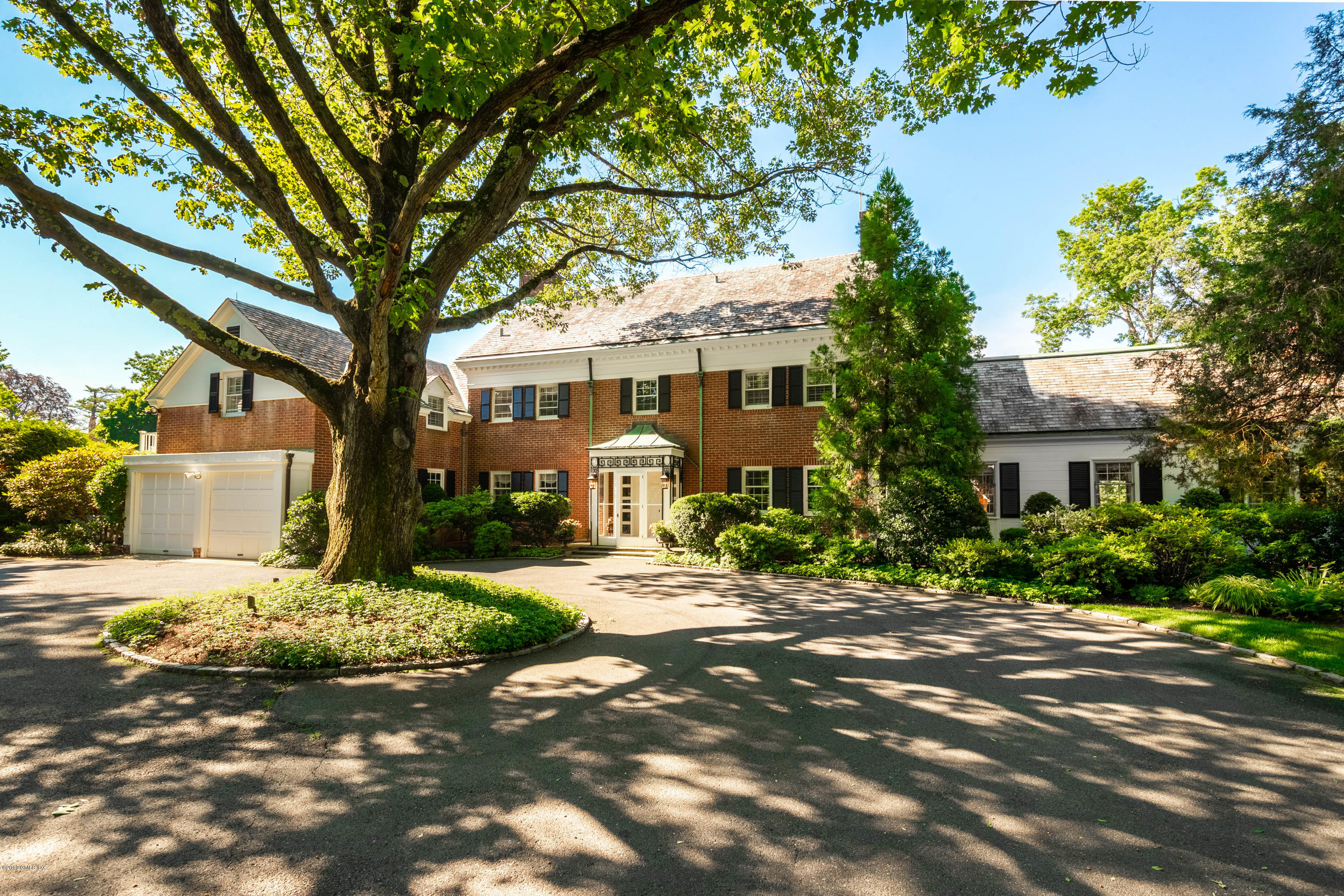 78-80 Cedar Cliff Road Riverside, CT 06878 - Photo 2 of 24 a front view of a house with garden