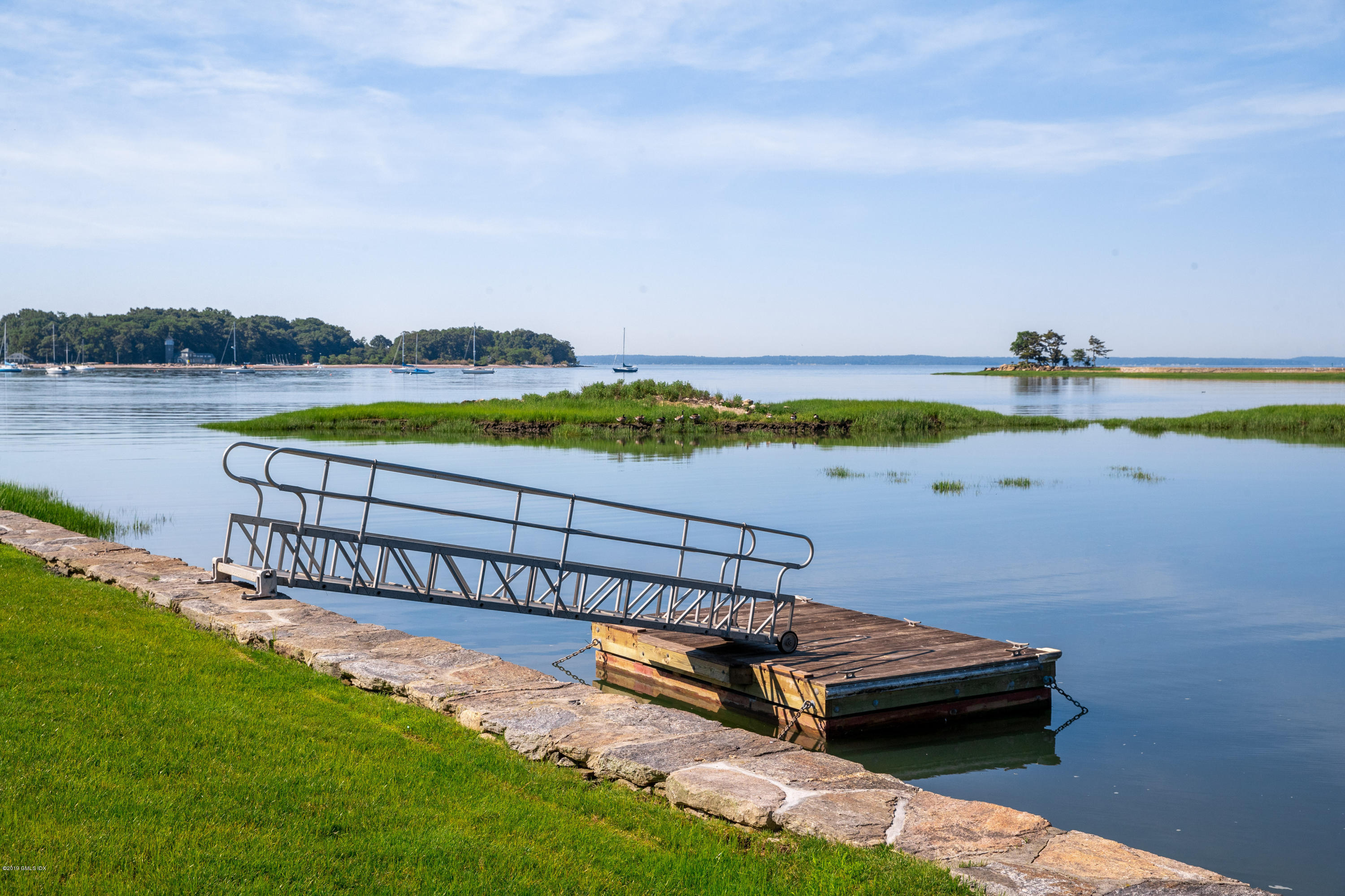 78-80 Cedar Cliff Road Riverside, CT 06878 - Photo 21 of 24 a view of a lake with outdoor space and a car park in the back