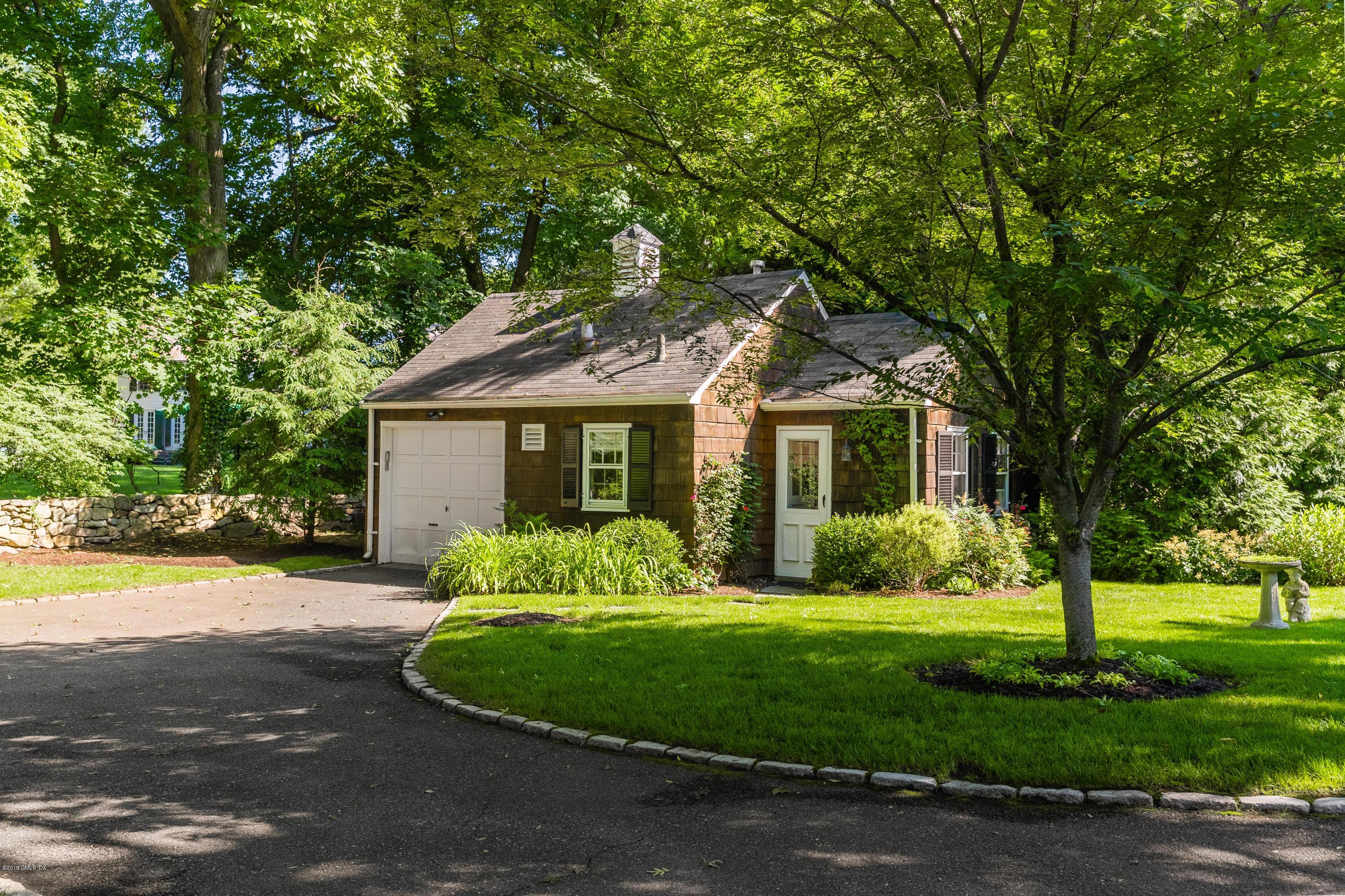 78-80 Cedar Cliff Road Riverside, CT 06878 - Photo 22 of 24 a front view of a house with a yard