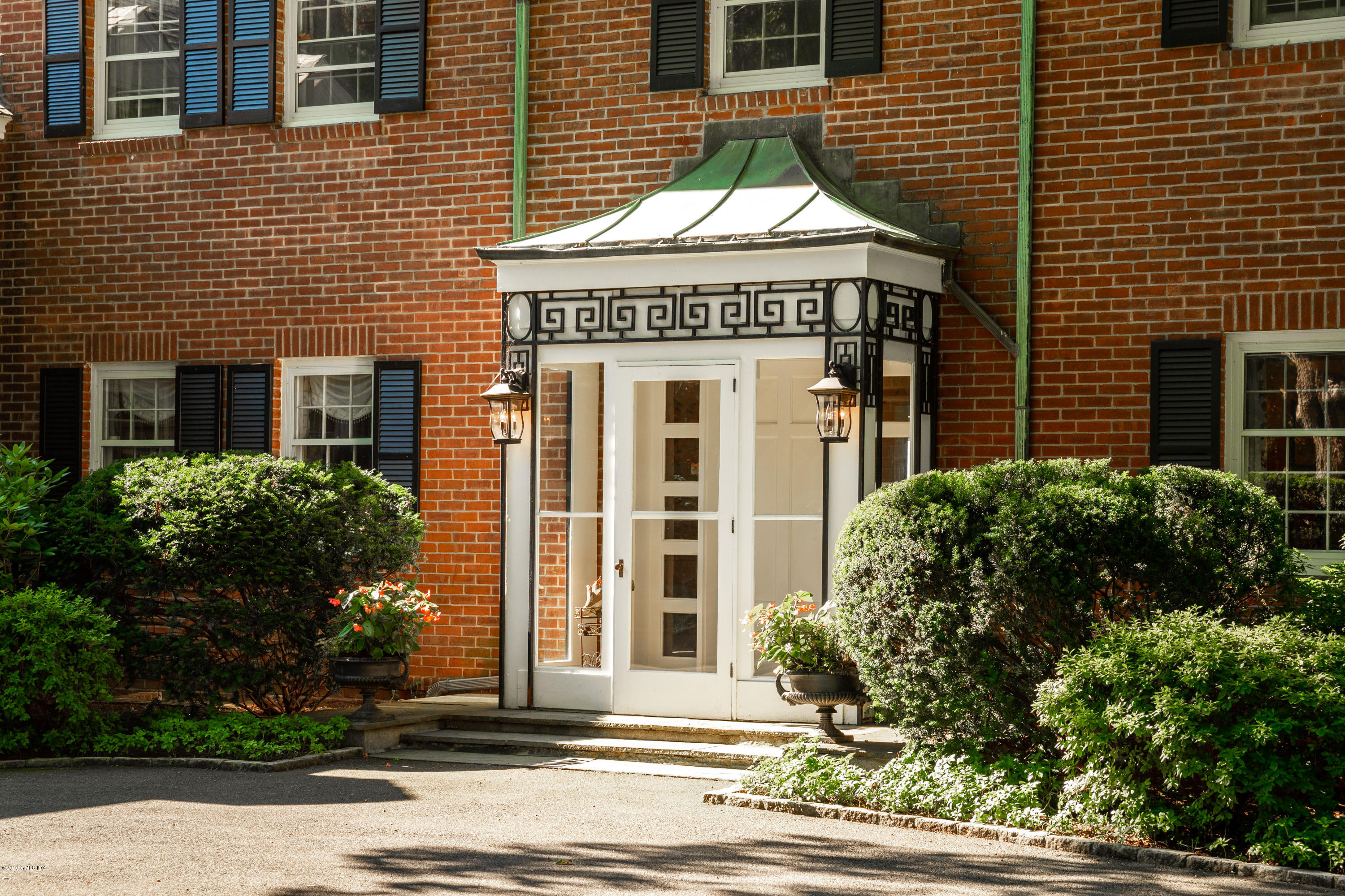 78-80 Cedar Cliff Road Riverside, CT 06878 - Photo 3 of 24 a front view of a house with a yard