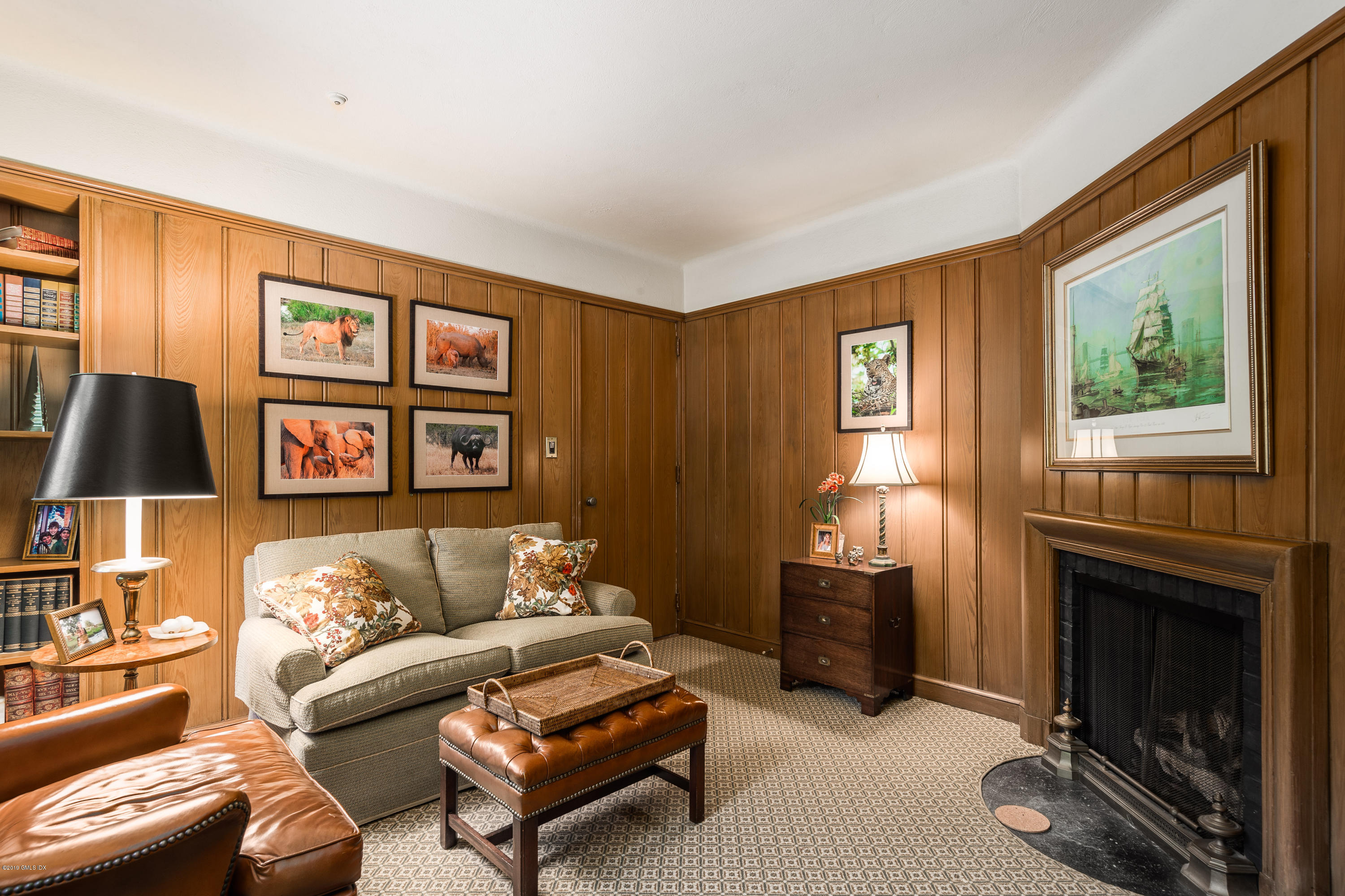 78-80 Cedar Cliff Road Riverside, CT 06878 - Photo 9 of 24 a living room with furniture a window and a fireplace