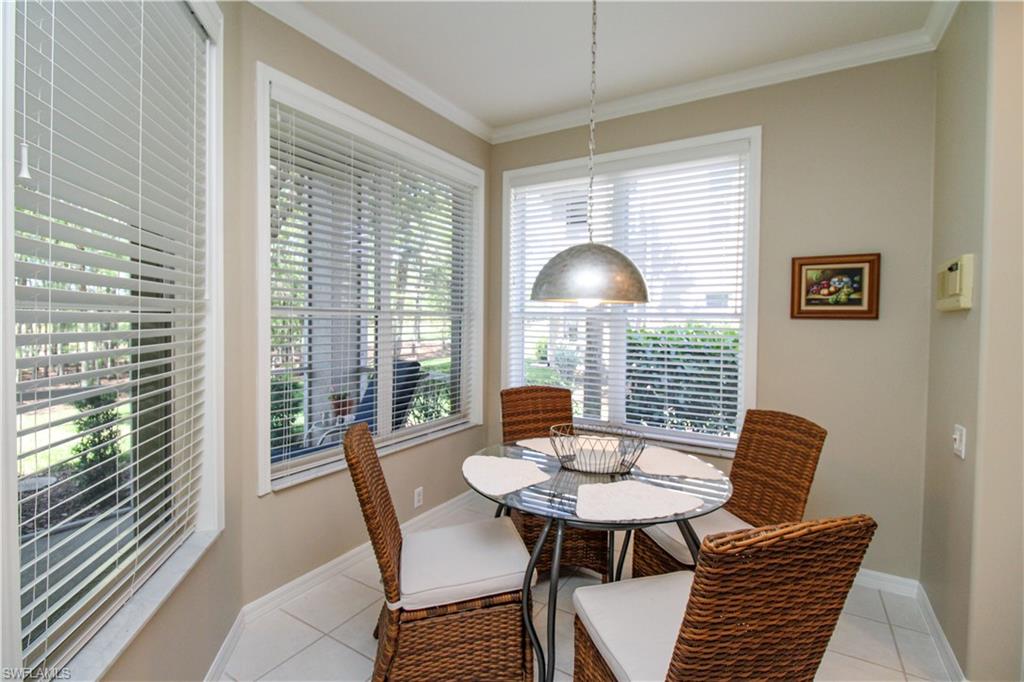 8488 Radcliffe Terrace, Unit 104 Naples, FL 34120 - Photo 11 of 50 a view of a dining room with furniture and window