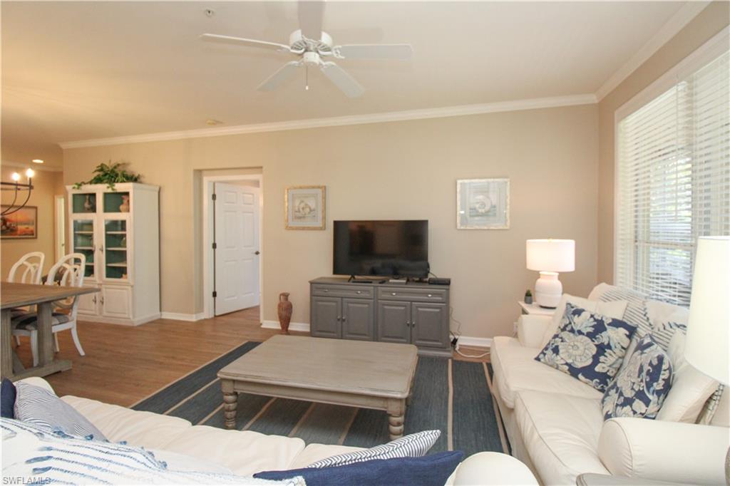 8488 Radcliffe Terrace, Unit 104 Naples, FL 34120 - Photo 18 of 50 a living room with furniture and a flat screen tv