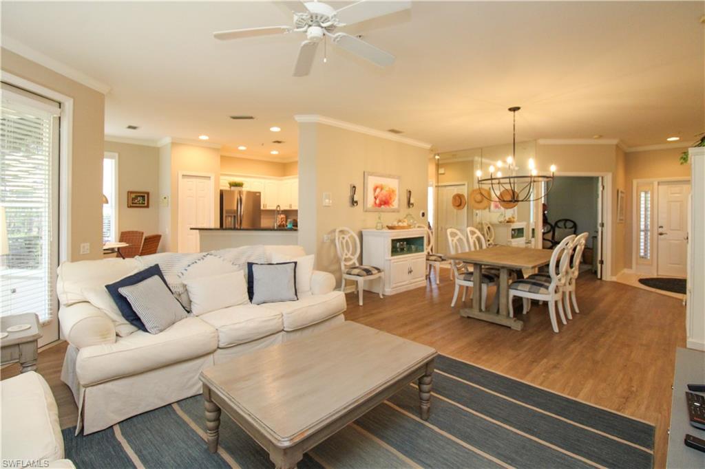8488 Radcliffe Terrace, Unit 104 Naples, FL 34120 - Photo 19 of 50 a living room with furniture and kitchen view