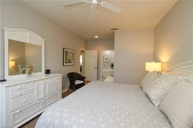 a spacious bathroom with a double vanity sink mirror and shower
