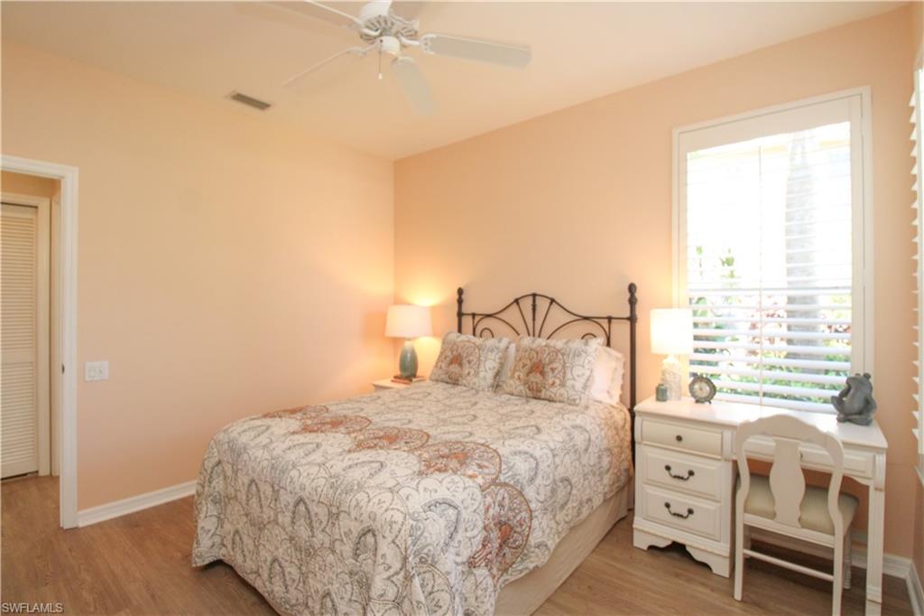 8488 Radcliffe Terrace, Unit 104 Naples, FL 34120 - Photo 34 of 50 a bedroom with a bed and a window