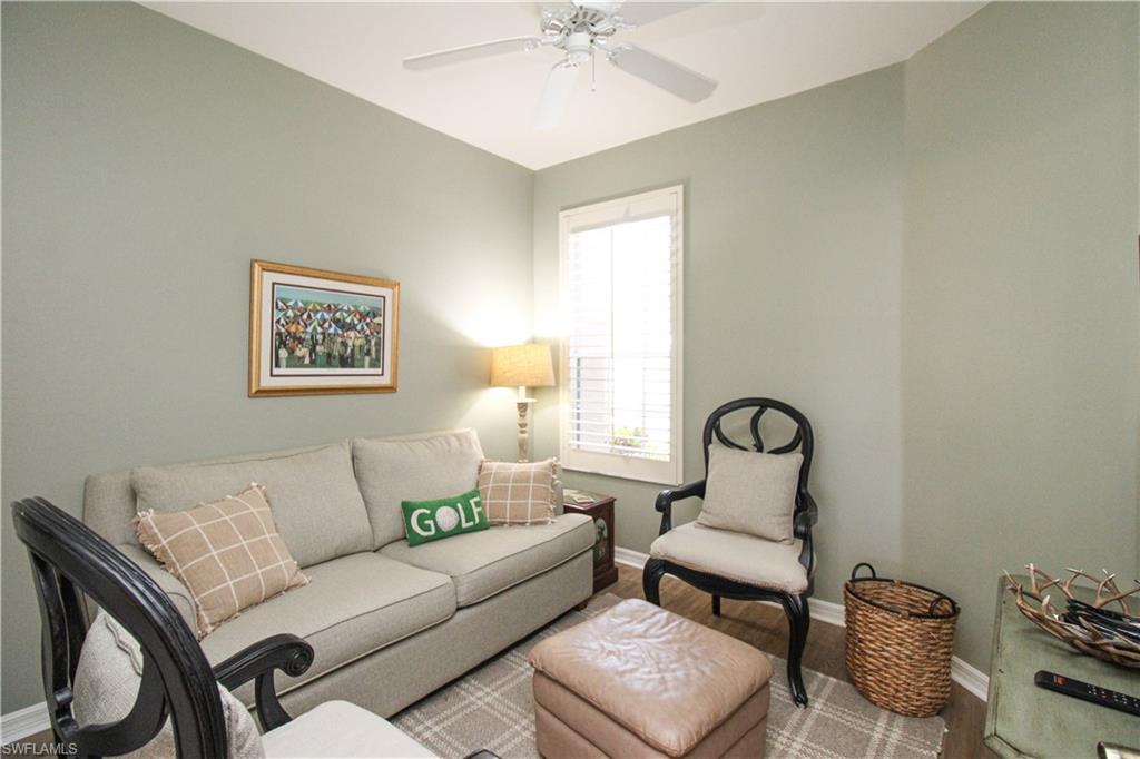 8488 Radcliffe Terrace, Unit 104 Naples, FL 34120 - Photo 38 of 50 a living room with furniture and a window
