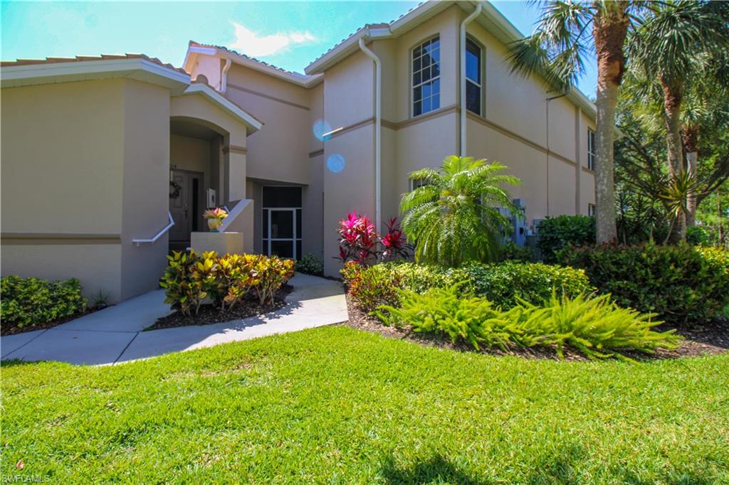 8488 Radcliffe Terrace, Unit 104 Naples, FL 34120 - Photo 40 of 50 a garden with a flower garden