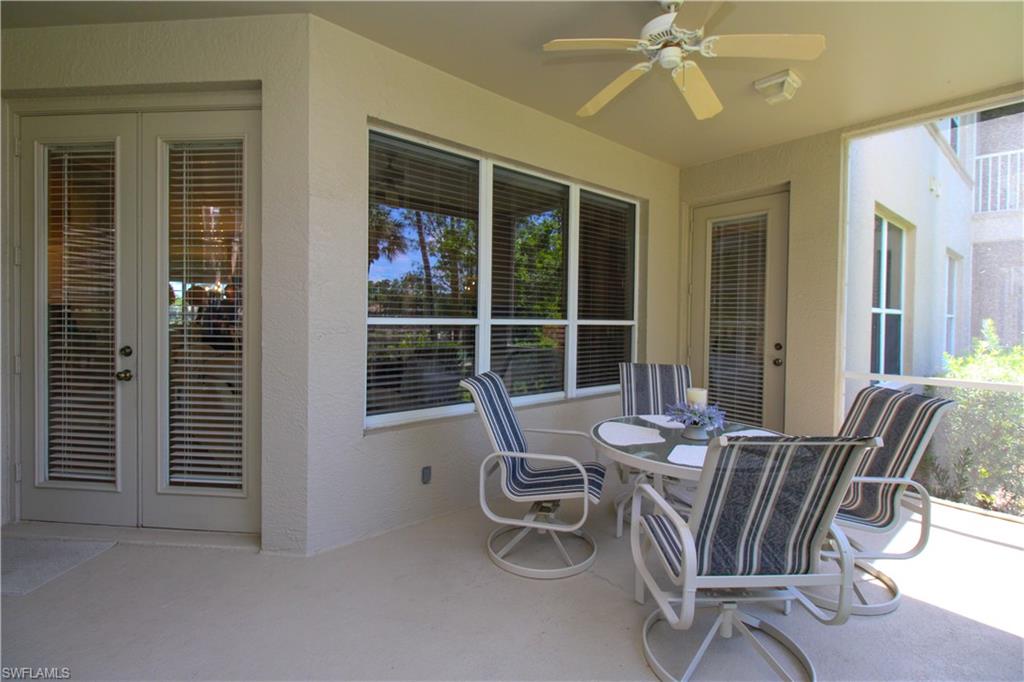 8488 Radcliffe Terrace, Unit 104 Naples, FL 34120 - Photo 41 of 50 a view of a dining room with furniture window and outside view
