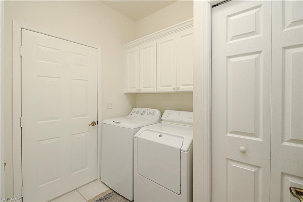 8488 Radcliffe Terrace, Unit 104 Naples, FL 34120 - Photo 43 of 50 a utility room with dryer and washer