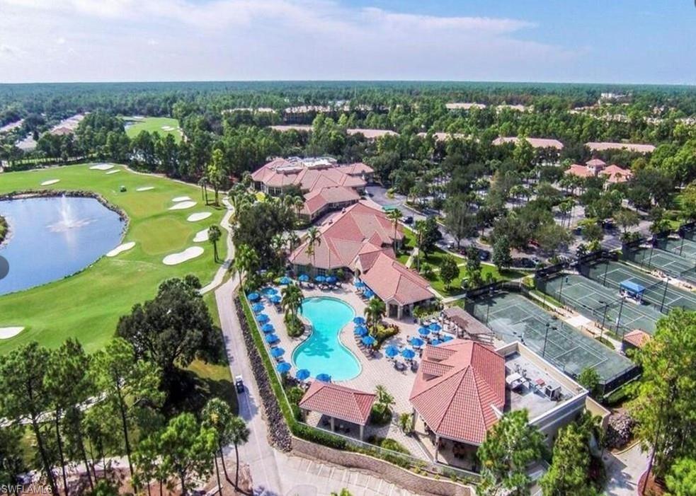 8488 Radcliffe Terrace, Unit 104 Naples, FL 34120 - Photo 44 of 50 an aerial view of residential houses with outdoor space and trees