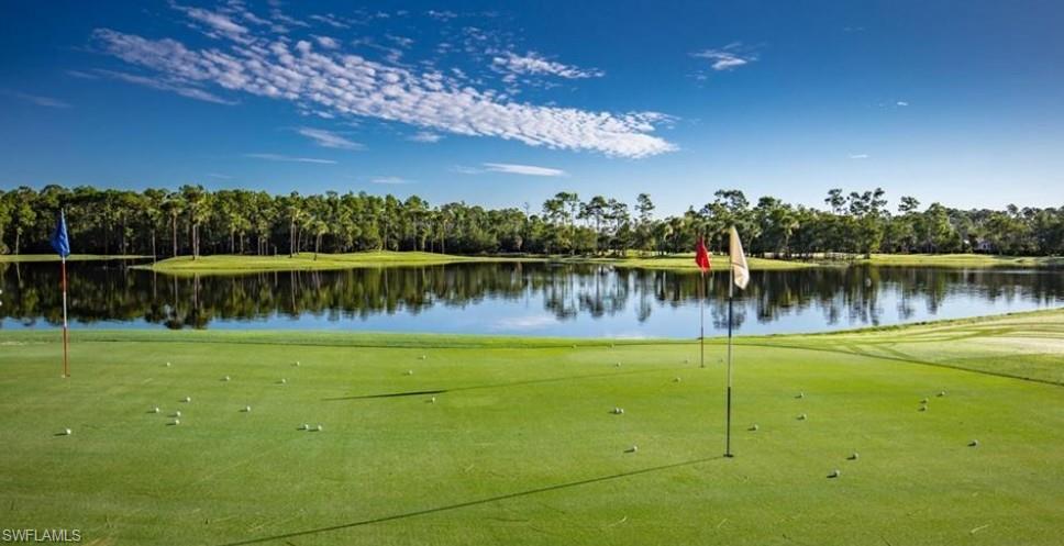 8488 Radcliffe Terrace, Unit 104 Naples, FL 34120 - Photo 47 of 50 a view of a lake with a big yard