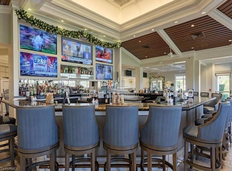 8488 Radcliffe Terrace, Unit 104 Naples, FL 34120 - Photo 48 of 50 a dining hall with lots of furniture and appliances