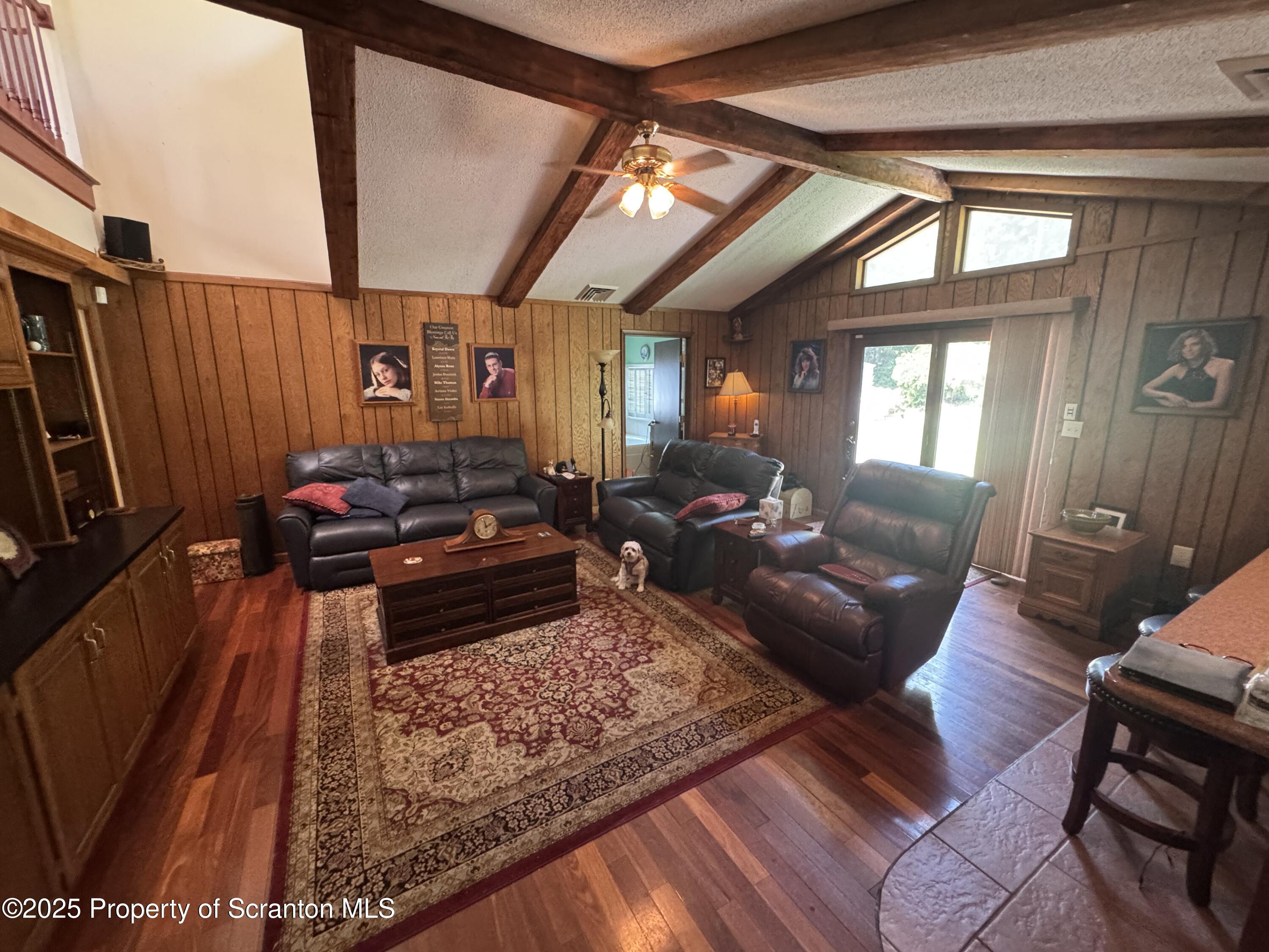 180 Savage Road Nicholson, PA 18446 - Photo 12 of 39 a living room with furniture rug and a large window