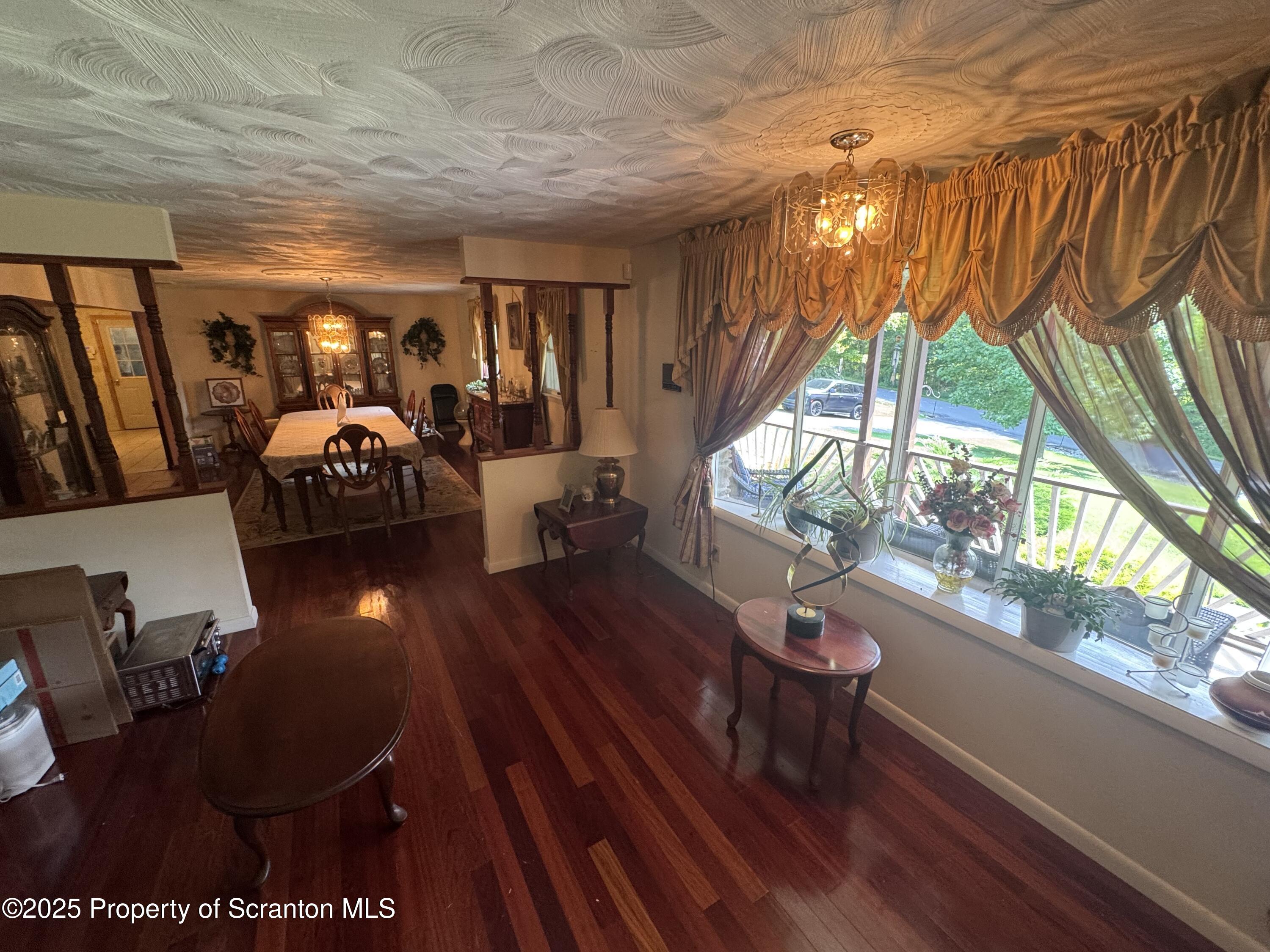 180 Savage Road Nicholson, PA 18446 - Photo 15 of 39 a living room with furniture a window and wooden floor