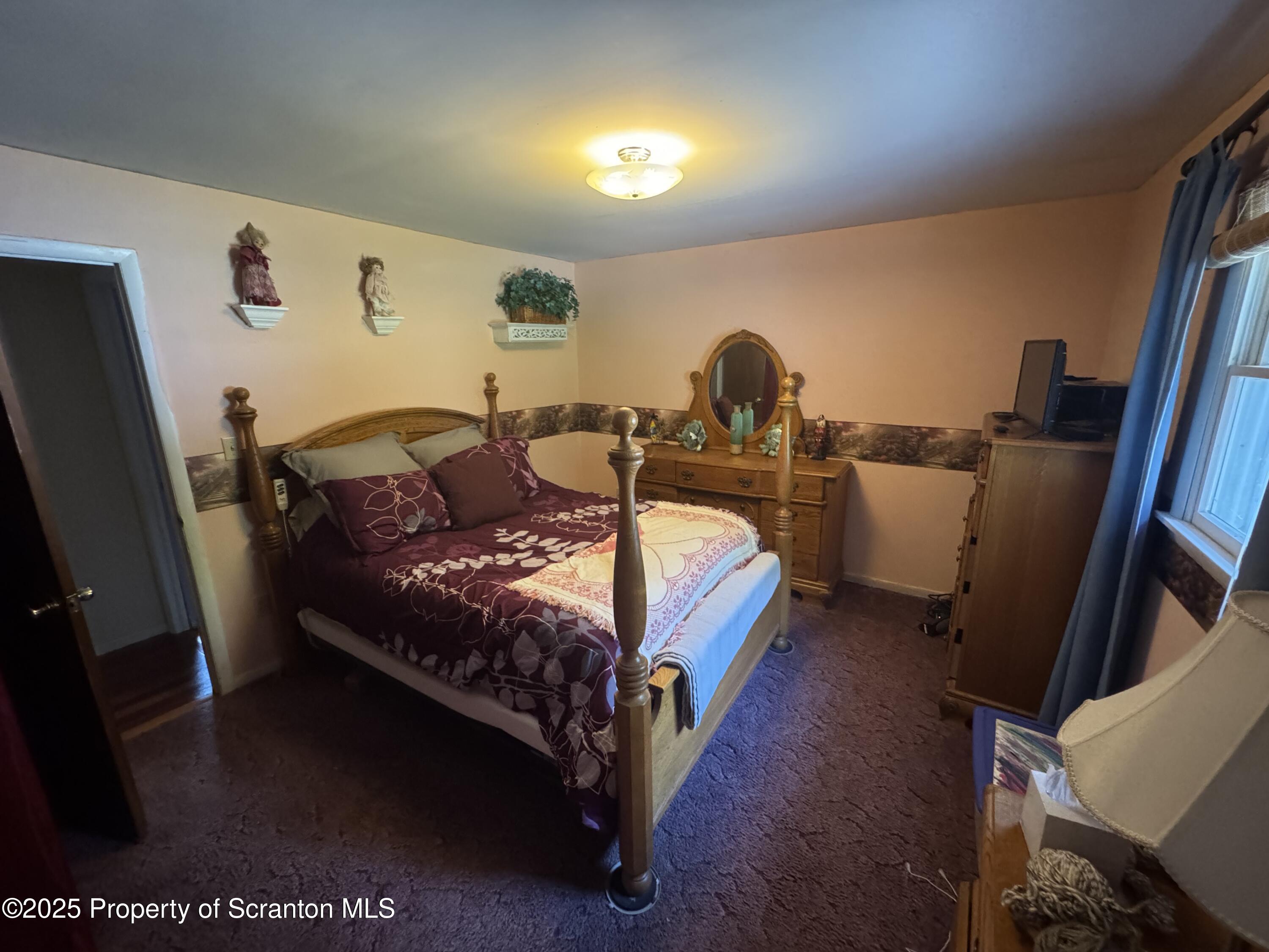 180 Savage Road Nicholson, PA 18446 - Photo 19 of 39 a bed room with a bed window and a chair