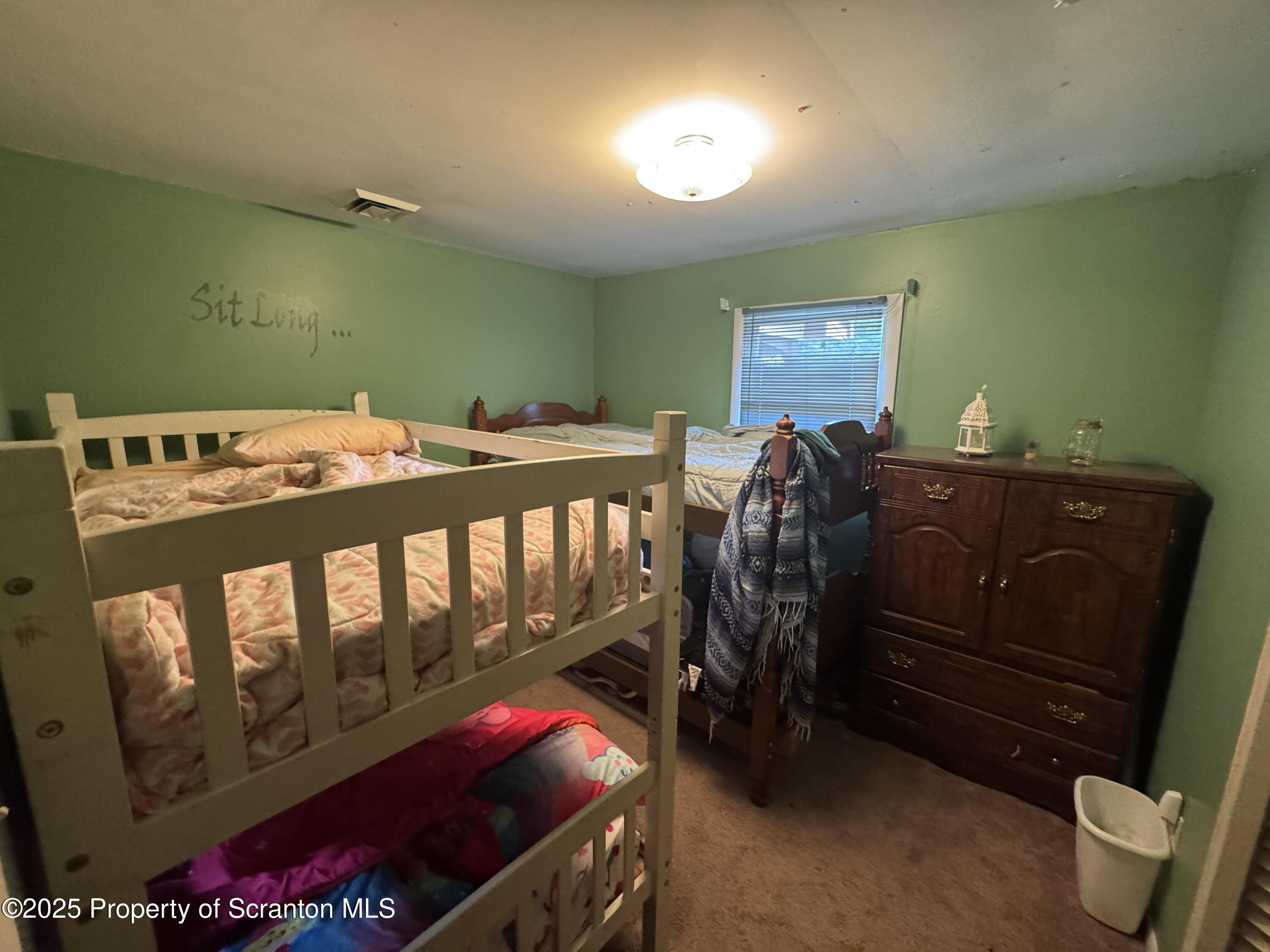 180 Savage Road Nicholson, PA 18446 - Photo 21 of 39 a bed room with a bed and a chair