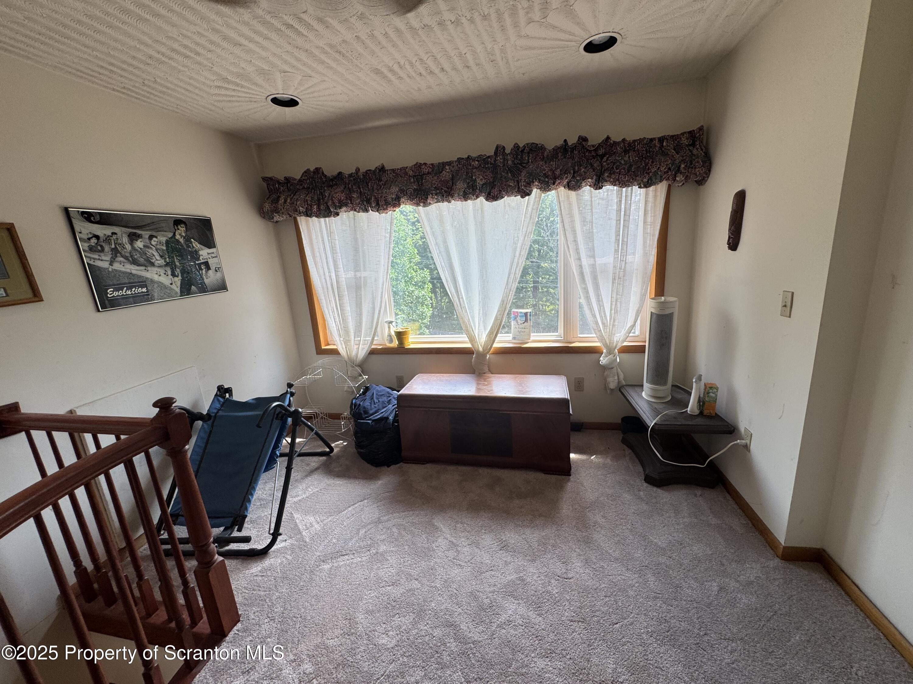 180 Savage Road Nicholson, PA 18446 - Photo 24 of 39 a living room with furniture and a large window