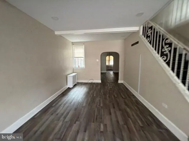 a view of gallery with wooden floor