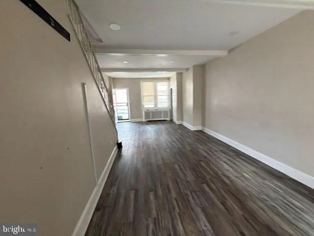 a view of entryway with wooden floor