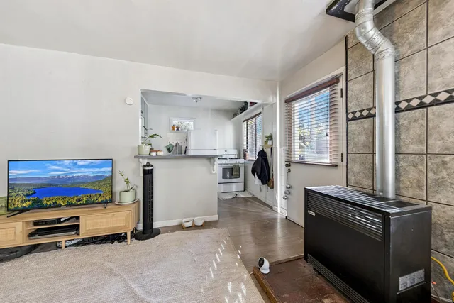 a kitchen with stainless steel appliances kitchen island granite countertop a stove and a refrigerator