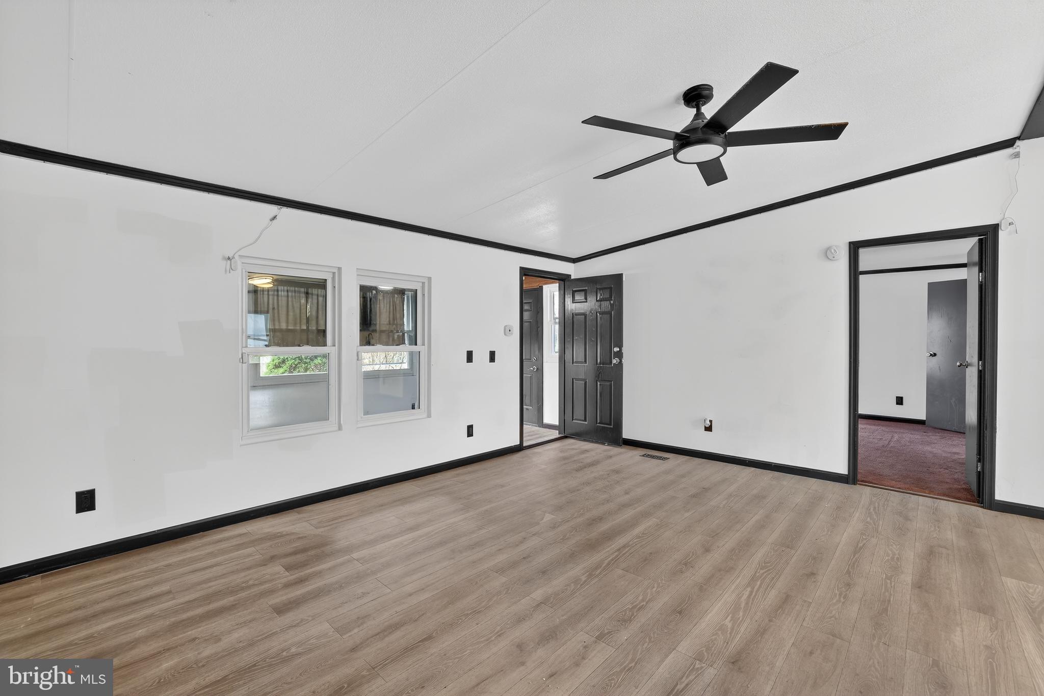 4901 Partlow Road Partlow, VA 22534 - Photo 11 of 48 from living room showing primary bedroom and porch