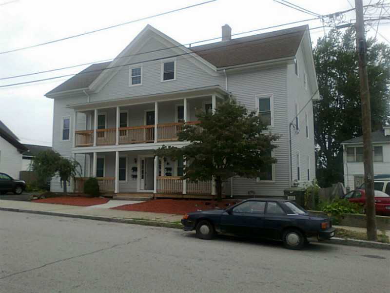 249 Grove Street Woonsocket, RI 02895 - Photo 2 of 7 Exterior Front. New vinyl, young roof windows