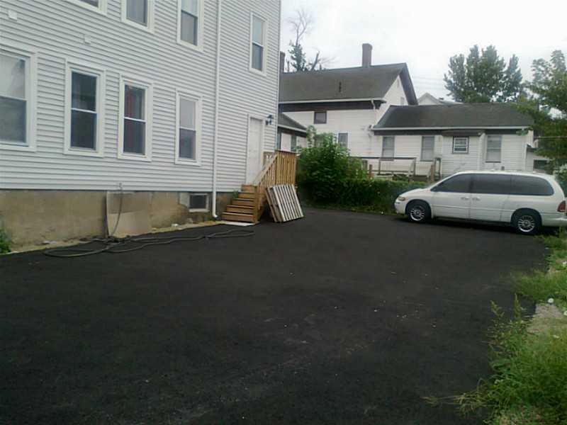 249 Grove Street Woonsocket, RI 02895 - Photo 3 of 7 Exterior Back. new driveway parking for 6 cars
