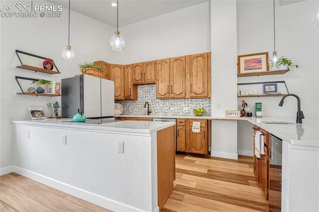 a white refrigerator freezer sitting inside of a kitchen