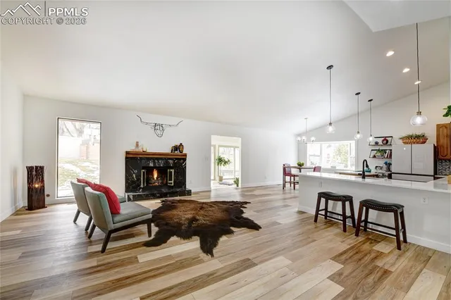 a fireplace with furniture and a window