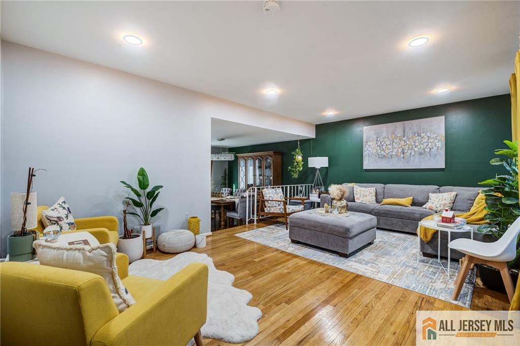 62 Laura Avenue Edison, NJ 08820 - Photo 16 of 35 a living room with furniture and a flat screen tv
