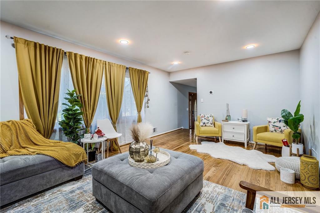 62 Laura Avenue Edison, NJ 08820 - Photo 17 of 35 a living room with furniture and a large window