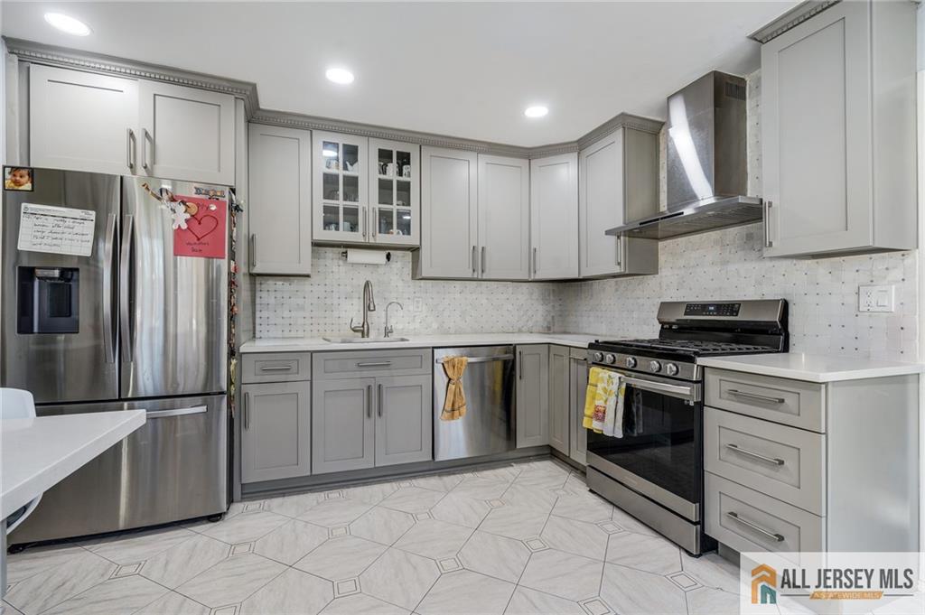 62 Laura Avenue Edison, NJ 08820 - Photo 20 of 35 a kitchen with stainless steel appliances granite countertop a refrigerator sink and stove