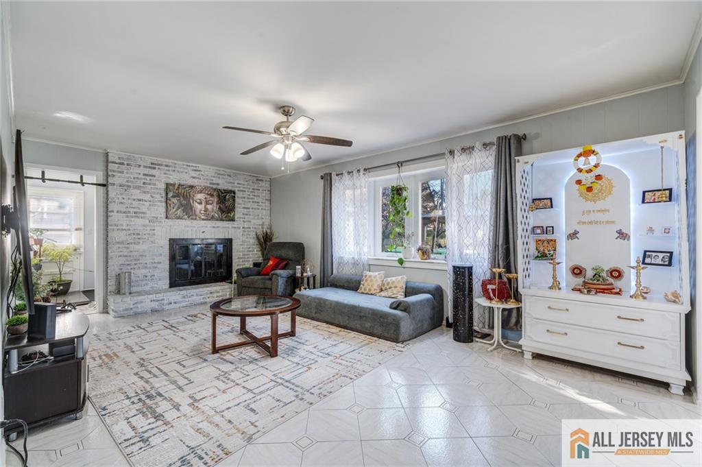 62 Laura Avenue Edison, NJ 08820 - Photo 22 of 35 a living room with furniture and a flat screen tv