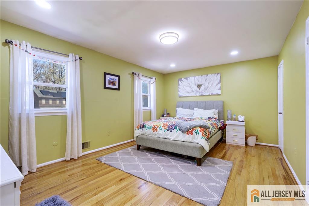 62 Laura Avenue Edison, NJ 08820 - Photo 25 of 35 a bedroom with a bed and window