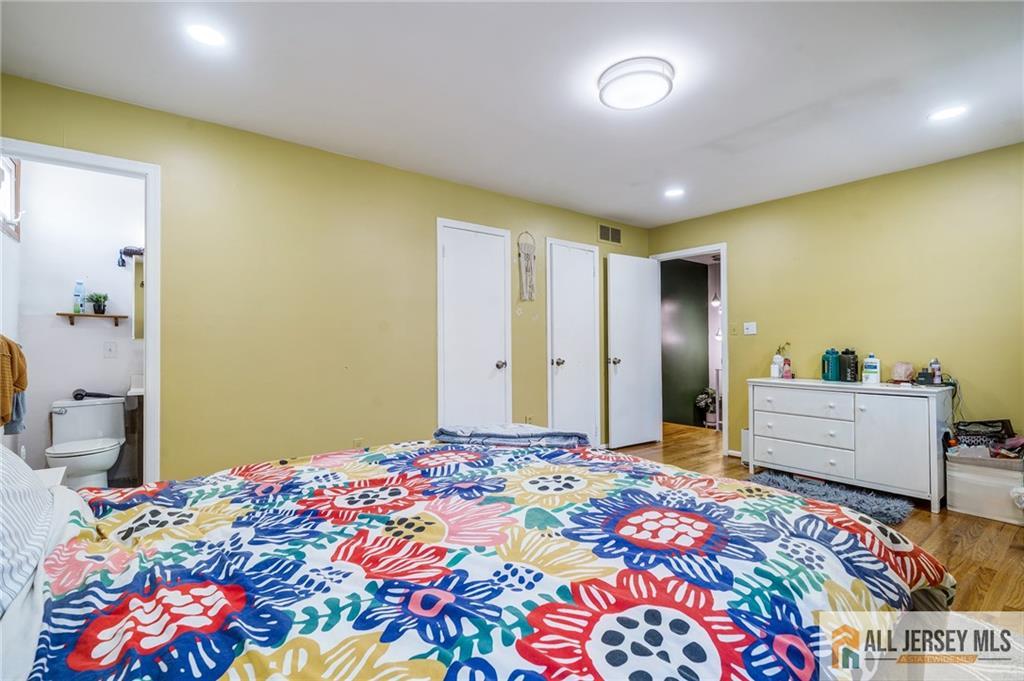 62 Laura Avenue Edison, NJ 08820 - Photo 26 of 35 a bedroom with a bed and a dresser