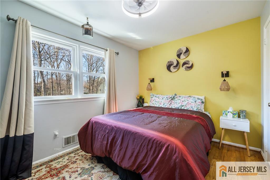 62 Laura Avenue Edison, NJ 08820 - Photo 30 of 35 a bedroom with a bed and a window