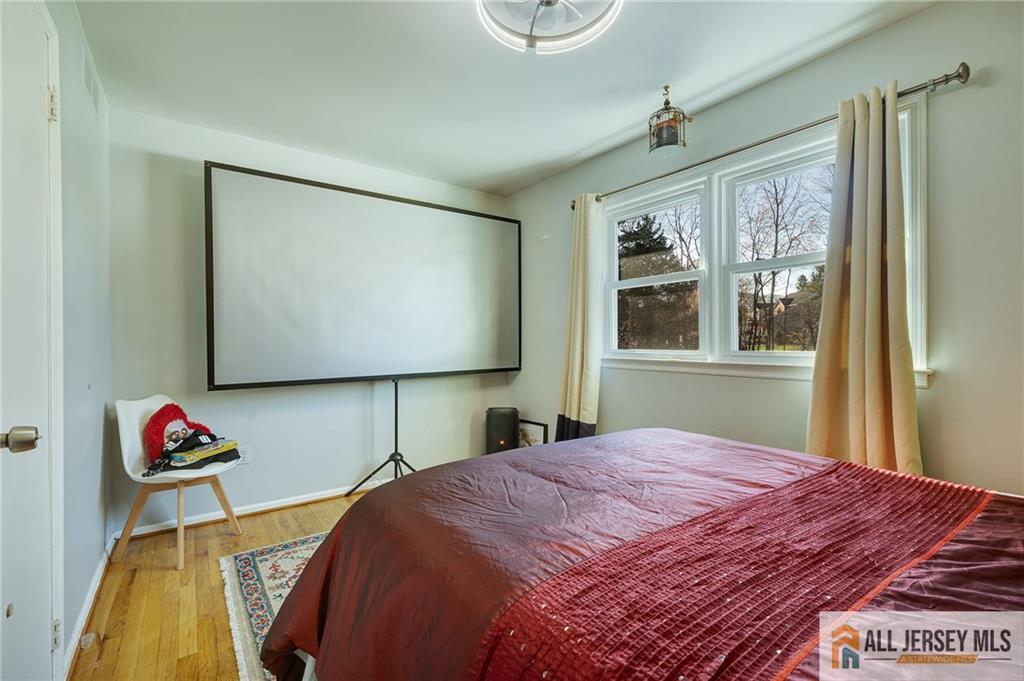 62 Laura Avenue Edison, NJ 08820 - Photo 31 of 35 a bedroom with a bed and a window