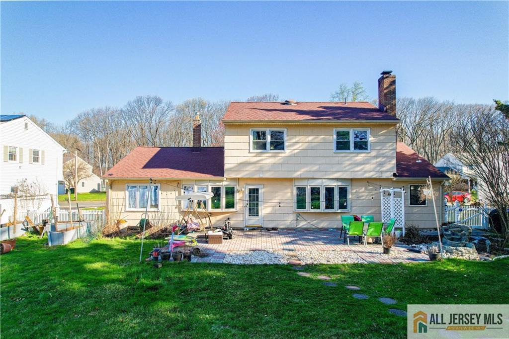 62 Laura Avenue Edison, NJ 08820 - Photo 6 of 35 a front view of a house with a garden and plants