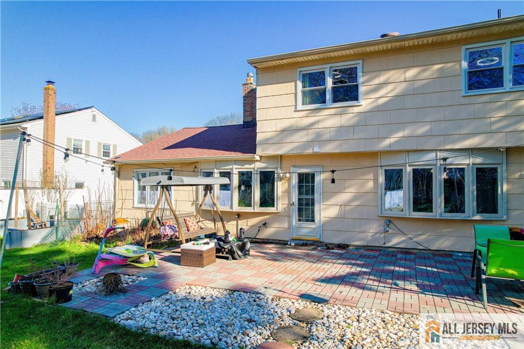 62 Laura Avenue Edison, NJ 08820 - Photo 7 of 35 a view of a house with yard and sitting area