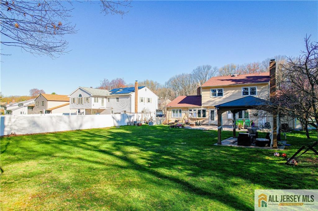 62 Laura Avenue Edison, NJ 08820 - Photo 8 of 35 a view of a house with a backyard