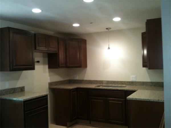 79 Barker Road Wareham, MA 02538 - Photo 5 of 7 a kitchen with granite countertop a sink cabinets and stainless steel appliances