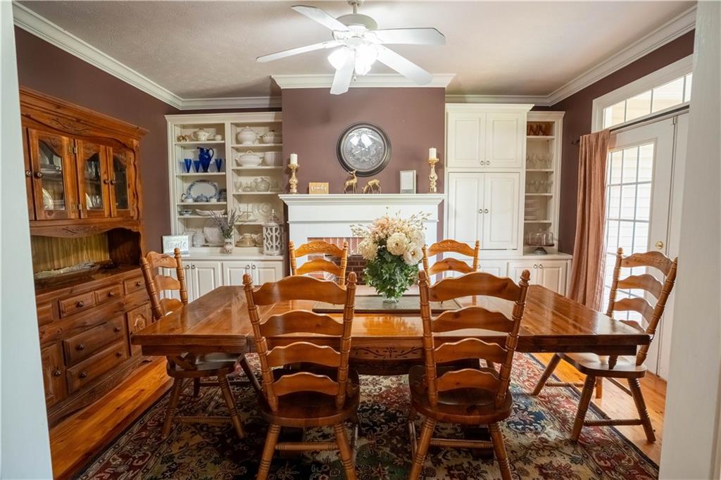 442 Buffalo Creek Road Carrollton, GA 30117 - Photo 11 of 39 a view of a dining room with furniture and chandelier
