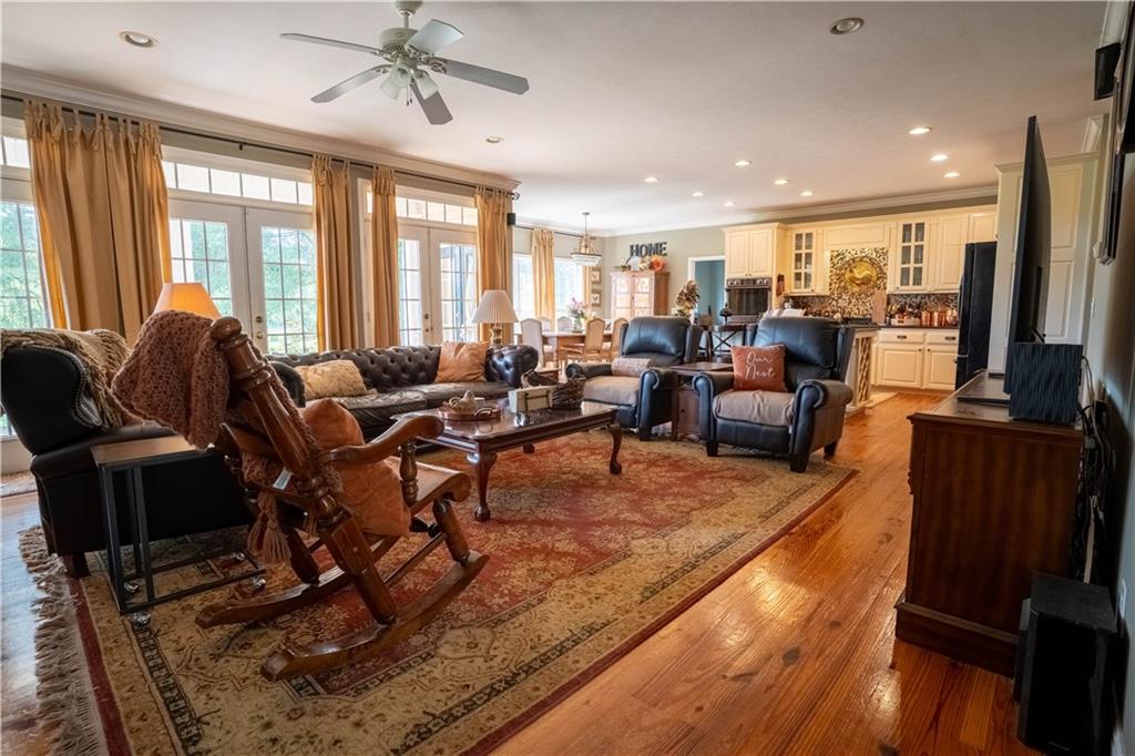 442 Buffalo Creek Road Carrollton, GA 30117 - Photo 13 of 39 a living room with furniture kitchen view and large windows