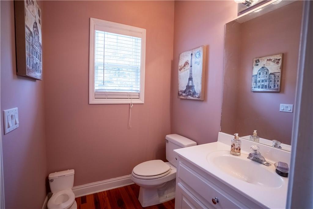 442 Buffalo Creek Road Carrollton, GA 30117 - Photo 22 of 39 a white toilet sitting next to a bathroom sink
