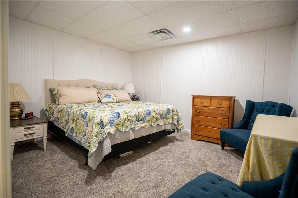 442 Buffalo Creek Road Carrollton, GA 30117 - Photo 29 of 39 a bedroom with a bed and a couch